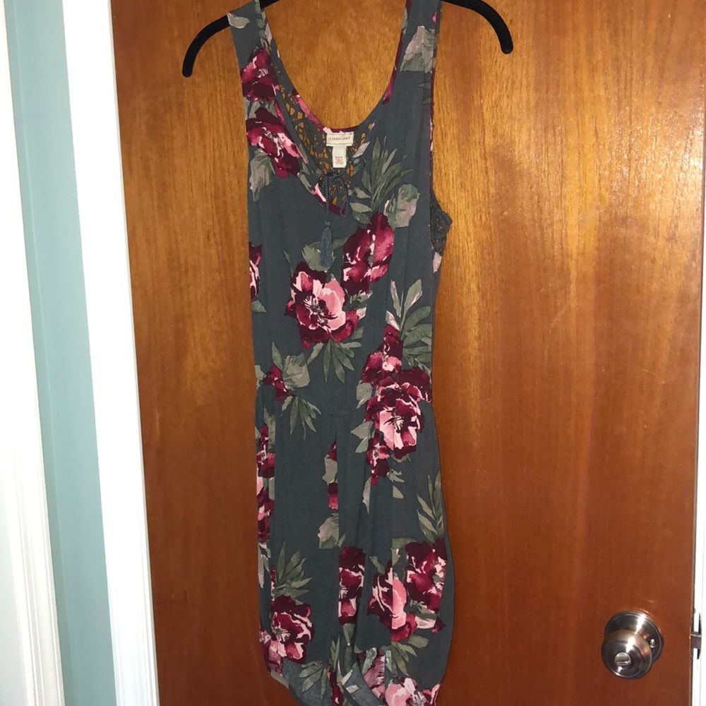 Green romper with red tropical flowers